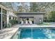 Backyard oasis boasts a large swimming pool and outdoor gym, perfect for fitness and relaxation at 299 Bampfield Dr, Mount Pleasant, SC 29464
