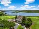 An aerial showcases a home and surrounding lush golf course, trees, and tranquil waters at 3034 Maritime Forest Dr, Johns Island, SC 29455
