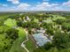 Stunning aerial view of the community's golf course, pool, tennis courts and lush landscape at 3034 Maritime Forest Dr, Johns Island, SC 29455