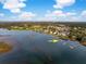 Panoramic aerial view of waterfront homes with private docks on the marsh with golf course in the background at 3034 Maritime Forest Dr, Johns Island, SC 29455