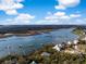 Aerial view of riverfront homes with private docks surrounded by lush greenery and expansive waterways at 3034 Maritime Forest Dr, Johns Island, SC 29455