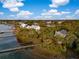 Waterfront homes nestled among trees, featuring private docks and serene river views at 3034 Maritime Forest Dr, Johns Island, SC 29455