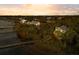 Scenic aerial view of a waterfront neighborhood with private docks surrounded by lush greenery and tranquil waters at 3034 Maritime Forest Dr, Johns Island, SC 29455