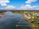 An aerial view features waterfront homes with private docks on the river at 3034 Maritime Forest Dr, Johns Island, SC 29455