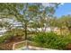 Expansive backyard showcasing lush greenery, mature trees, and scenic waterfront views from an elevated vantage point at 3034 Maritime Forest Dr, Johns Island, SC 29455
