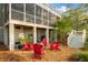 Charming backyard setup with Adirondack chairs around a fire pit, ideal for outdoor gatherings and relaxation at 3034 Maritime Forest Dr, Johns Island, SC 29455