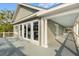 Large balcony with covered area and white columns overlooking a scenic view at 3034 Maritime Forest Dr, Johns Island, SC 29455