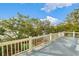 Expansive balcony showcasing lush greenery and serene views on a bright, sunny day at 3034 Maritime Forest Dr, Johns Island, SC 29455