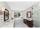 Elegant bathroom featuring dual vanities, a soaking tub, and a glass-enclosed shower at 3034 Maritime Forest Dr, Johns Island, SC 29455
