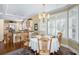 Charming dining area with bright natural light, hardwood floors and views of the kitchen at 3034 Maritime Forest Dr, Johns Island, SC 29455
