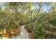 A gravel driveway surrounded by lush trees covered in spanish moss at 3034 Maritime Forest Dr, Johns Island, SC 29455