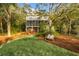 Charming home with a screened porch, a lush backyard, and a private path leading to the waterfront at 3034 Maritime Forest Dr, Johns Island, SC 29455