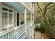 Charming front porch with elegant columns and a view of lush foliage at 3034 Maritime Forest Dr, Johns Island, SC 29455