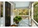 Inviting front porch featuring a dark-painted front door and a potted fern at 3034 Maritime Forest Dr, Johns Island, SC 29455