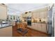 Spacious kitchen with stainless appliances, an island, and hardwood floors that flow into the living area at 3034 Maritime Forest Dr, Johns Island, SC 29455