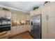 Eat-in kitchen featuring custom cabinets, stainless steel appliances, and hardwood floors at 3034 Maritime Forest Dr, Johns Island, SC 29455