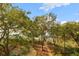 Scenic view of lush trees, a winding path, and glimpses of the water beyond at 3034 Maritime Forest Dr, Johns Island, SC 29455