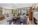 Expansive living room with comfortable seating, fireplace, and views of the water at 3034 Maritime Forest Dr, Johns Island, SC 29455