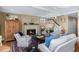 Cozy living room featuring a fireplace, hardwood floors, and comfortable seating at 3034 Maritime Forest Dr, Johns Island, SC 29455