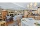 Bright living room with fireplace that flows into the kitchen and dining area at 3034 Maritime Forest Dr, Johns Island, SC 29455