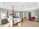 Bright main bedroom with tray ceiling, walk-in closet, and stylish four poster bed at 3034 Maritime Forest Dr, Johns Island, SC 29455