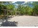 An outdoor seating area with swings offers a tranquil setting in a treed lot at 3034 Maritime Forest Dr, Johns Island, SC 29455
