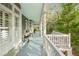 Spacious and airy porch with classic railings and ample natural light at 3034 Maritime Forest Dr, Johns Island, SC 29455