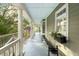 Spacious covered porch with seating, and views of the lake at 3034 Maritime Forest Dr, Johns Island, SC 29455