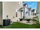 Cozy backyard patio with seating, green grass, and well-maintained landscaping at 312 White Gables Dr, Summerville, SC 29483