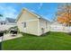 Well-kept backyard with artificial turf and access to the detached garage at 312 White Gables Dr, Summerville, SC 29483