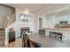 Dining area features a wood table with fireplace, TV, and kitchen view at 312 White Gables Dr, Summerville, SC 29483