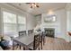 Open dining area with fireplace, television, and view of staircase at 312 White Gables Dr, Summerville, SC 29483