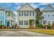 Charming two-story home with inviting front porch and manicured landscaping and adjacent building at 312 White Gables Dr, Summerville, SC 29483