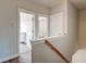 Upstairs hallway with natural light and neutral walls at 312 White Gables Dr, Summerville, SC 29483