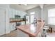 Modern kitchen with white cabinets, stainless appliances, stone backsplash and butcher block counters at 312 White Gables Dr, Summerville, SC 29483