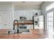 Well-lit kitchen showcasing stainless steel appliances, wood countertops, white cabinetry, and modern fixtures at 312 White Gables Dr, Summerville, SC 29483