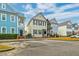 Charming street showcasing colorful two-story homes, brick-lined sidewalks, and manicured front yards at 312 White Gables Dr, Summerville, SC 29483