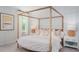 Tranquil main bedroom with natural light, elegant decor, and a four-poster bed at 318 Archar St, Summerville, SC 29486
