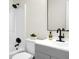 This bathroom features black fixtures, a shower, and a gray vanity with ample storage space at 319 Bluebell Ave, Summerville, SC 29483