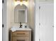 Stylish bathroom featuring a modern vanity, updated mirror, and contemporary lighting fixtures at 319 Bluebell Ave, Summerville, SC 29483