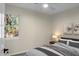 A cozy bedroom with a large window and ceiling fan provides natural light and air circulation at 319 Bluebell Ave, Summerville, SC 29483