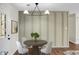 Stylish dining area featuring a round table, modern lighting fixture, and elegant decor at 319 Bluebell Ave, Summerville, SC 29483