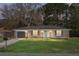 Charming single-story brick home with a well-manicured lawn and attached garage, creating a cozy and inviting curb appeal at 319 Bluebell Ave, Summerville, SC 29483