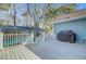 A spacious back deck with a screened-in pool and a Weber grill on a clear, sunny day at 32 Monte Sano Dr, Hanahan, SC 29410