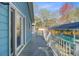 The back deck leads to a screened-in pool with clear blue skies above at 32 Monte Sano Dr, Hanahan, SC 29410
