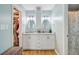 Bathroom featuring double vanity sinks with granite countertops and custom white cabinets at 32 Monte Sano Dr, Hanahan, SC 29410