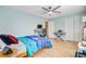 Sunlit bedroom features hardwood floors, ceiling fan and a modern work-from-home setup at 32 Monte Sano Dr, Hanahan, SC 29410