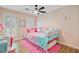 Adorable pink bedroom with white trim, shutters, and a daybed with cute pillows and fuzzy bedding at 32 Monte Sano Dr, Hanahan, SC 29410