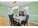 Open-concept dining room featuring stylish lighting and seamless flow into adjacent rooms at 32 Monte Sano Dr, Hanahan, SC 29410