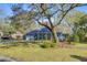 Inviting single-Gathering home with solar panels, a large yard, and a beautiful mature tree at 32 Monte Sano Dr, Hanahan, SC 29410